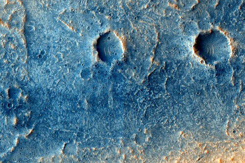 Changing Dark Spot on the Floor of Kasei Valles (PSP_009552_2065) Credit: NASA/JPL/University of Arizona